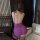 Woman wearing purple tonaer sexy lace chemise, sheer mesh babydoll nightgown set with open back and thin straps.