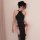 A woman poses in a black 1945-inspired sexy role play lingerie, featuring a high-slit long dress with retro chinese-style ero...