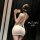 Woman wearing pure & seductive lingerie set, a sexy secretary-style outfit with elegant backless design and bow details.