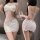 Woman wearing white lace bodysuit with open crotch, sheer panels, and delicate floral embroidery; sexy maid-style lingerie se...