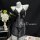 Black lace bodysuit with sheer mesh, low-cut bust and cut-outs on mannequin. summer sexy lace bodysuit by peritreasure.