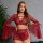 Woman modeling red lace lingerie set with deep v, flared sleeves, and detachable ties.