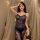 Curvy woman wearing a plus size lace babydoll dress, a sexy sheer mesh sleepwear set designed for women up to 200 lbs.