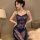 Curvy woman wearing a sheer navy blue lace babydoll dress, a sexy mesh sleepwear set designed for plus size figures up to 200...