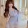 Woman wearing plus size lace sleepwear set with sheer mesh and french lace cami nightgown in soft lavender, featuring bow det...