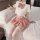 Woman wearing plus size sexy jk uniform set with white crop top, pink plaid bow tie, pleated mini skirt, and thigh-high stock...