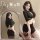 Woman modeling black plus size secretary style lingerie set with bodysuit and mini skirt for seductive sleepwear.
