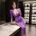 Woman wearing purple lace nightgown with side slit, bodycon fit, elegant sleepwear dress for plus size women up to 200 lbs.