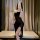 Woman wearing a black plus size sexy lingerie set, featuring a seductive robe style design for busty figures.