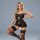 Woman modeling black lace sleep dress with sheer back, high slit, and garter belt – premium erotic lingerie set.