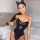 Sexy black pu bodysuit with plunging neckline and cat ears headband, trendy european-american style fall winter outfit.