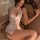 Sexy lace sleepwear set featuring deep v-neckline and sheer stockings, inspired by traditional chinese design.