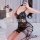 Sexy black glossy pvc mini skirt outfit with lace detailing, perfect for bondage enthusiasts.