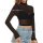 Woman wearing a black sheer mesh long sleeve crop top paired with blue jeans, showcasing a bold and confident style.