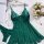 Emerald green lace chemise and matching set displayed on white background with floral accents and pearl jewelry.
