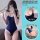 Woman modeling navy blue suqing one-piece bodysuit with white trim, featuring deep u neckline and open-crotch design for easy...