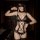 Woman wearing black lace open-crotch bodysuit with matching choker, blindfold, and garter straps for intimate date night.
