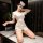 Woman posing in white 2025 sexy nurse costume set – authentic nurse uniform for cosplay & role play, kneeling on marble tab...