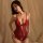 Woman wearing red suqing 2025 sexy lace lingerie set – sheer alluring sleep dress with adjustable straps, elegant nightwear.
