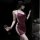 Woman in burgundy high-slit lace sleep dress holding wine glass, elegant at-home lingerie ensemble with low-cut design.