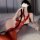 Sexy womens erotic lingerie set featuring a red lace bodysuit with chains and cutouts, perfect for bold fashion statements.