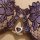Close-up of the 2026 luxury lingerie set, featuring a sheer purple lace bra with satin ribbons and a sparkling crystal heart ...
