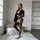 Elegant black bodysuit with sheer lace mesh design, one-shoulder long sleeve, perfect for nightclub wear, performance outfits...
