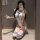 Woman in mirror selfie wearing white student-themed cosplay lingerie with blue stripes, knee-high socks, and side ties.