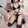 Sexy black leather bondage outfit featuring a halter top, thigh-high stockings, and heart-themed accessories. perfect for cos...