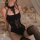 Elegant black lace bodysuit with delicate cutouts, featuring a hook neck design for a sensual look. perfect for intimate wear...