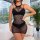 Woman modeling a black sheer lace lingerie dress with a high neckline and cutouts, perfect for valentines day.