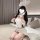 A woman wearing a white maid costume with bunny ears, featuring a cute design suitable for plus-size women. the outfit includ...