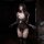 Woman wearing luxury lace bodysuit with sheer mesh, elegant cutouts, and long gloves in a dimly lit room.