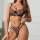 Woman wearing french-style ultra-thin lace push-up bra and matching briefs, no-pad seductive lingerie set with floral embroid...
