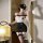 Woman wearing chao mu seductive lingerie set - busty police cosplay outfit, holding a whip in a dimly lit room.