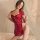 Woman modeling red lace cheongsam dress with sheer sleeves and high slit, bodycon fit for small bust, alluring mini qipao sty...