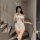 Woman modeling white bunny bodysuit with ruffles, sheer panels, and open-crotch design — mannye qing plus size lace costume w...