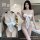 Luxury lace lingerie set featuring a seductive three-piece bra and matching sleepwear with elegant bow detail.