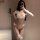 Woman modeling qqny seductive lounge set - white lace lingerie with pearls, bows, and thigh-high stockings for luxury sensual...