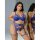Woman modeling qimengya blue lace thong set with thigh rings, seductive 3-piece lingerie for intimate wear.