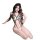Woman wearing leopard print lingerie set with black straps and beige cups, featuring a seductive design for sleepwear.