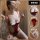 Woman modeling red lace bodysuit with open crotch and sheer bust, plus size tight-fit sleepwear set.