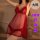 Model wearing red sheer plus size lingerie sleep set with polka dots and feather trim for date nights.