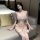 Woman modeling white ailenni lace lingerie set with bra, panty, and matching robe in bedroom setting.