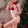 Woman in red lace lingerie set with bunny ears, posing by christmas tree. perfect for festive holiday costumes.