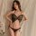 Woman modeling black butterfly bodysuit lingerie with adjustable straps and open-crotch design, styled as seductive sleepwear...