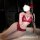 Woman modeling red lace babydoll nightgown with butterfly tie straps and push-up bra, sheer design, elegant lingerie set.