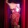 Woman wearing red dunhuang flying apsara lingerie set with gold-embossed sheer mesh bustier and skirt, back view.