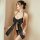 Woman wearing black satin halter bodysuit with large bow front and backless design, paired with matching thong.