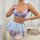 Model wearing european-style purple lace lingerie set with bra, sheer skirt & bows.